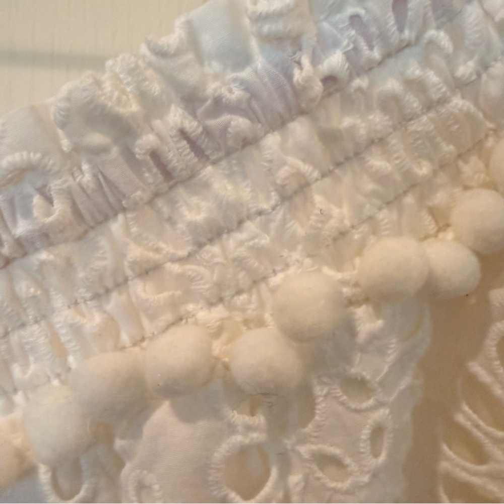 Your summer goto Lilly Pulitzer White Eyelet Off-Shoulder Tunic with PomPom Trim - Picture 4 of 10
